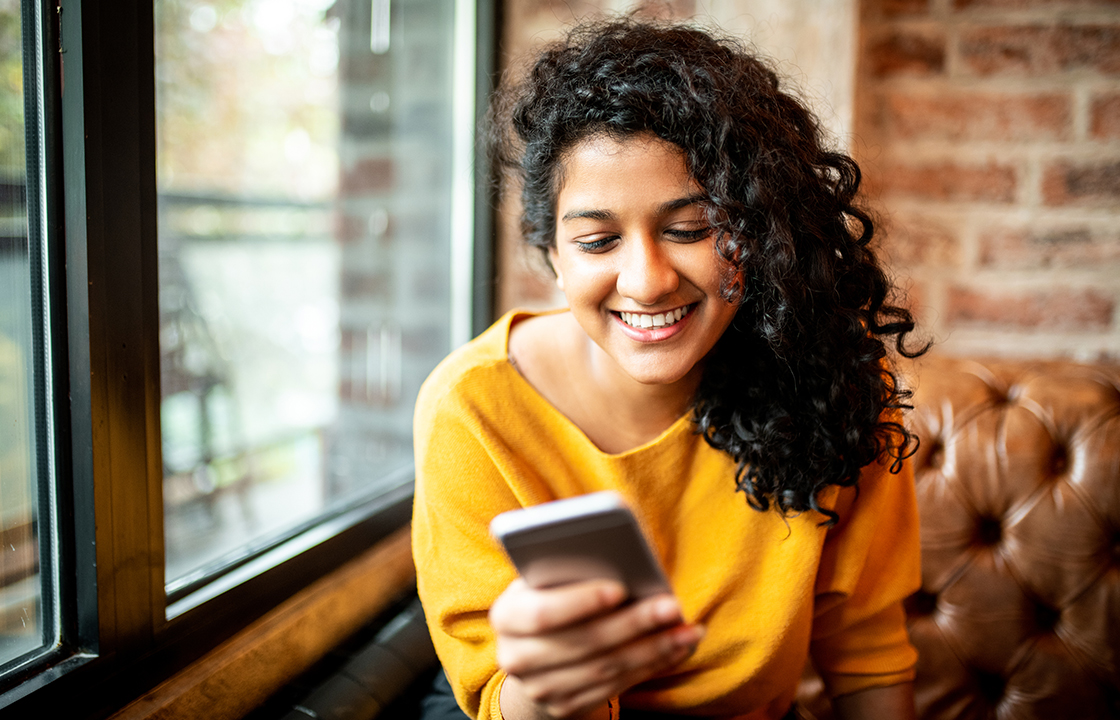 woman holding a cell phone