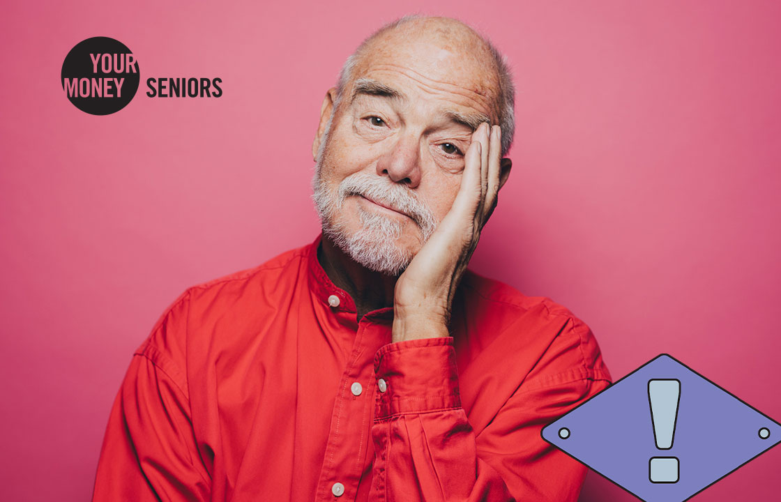 senior man resting his head in one hand