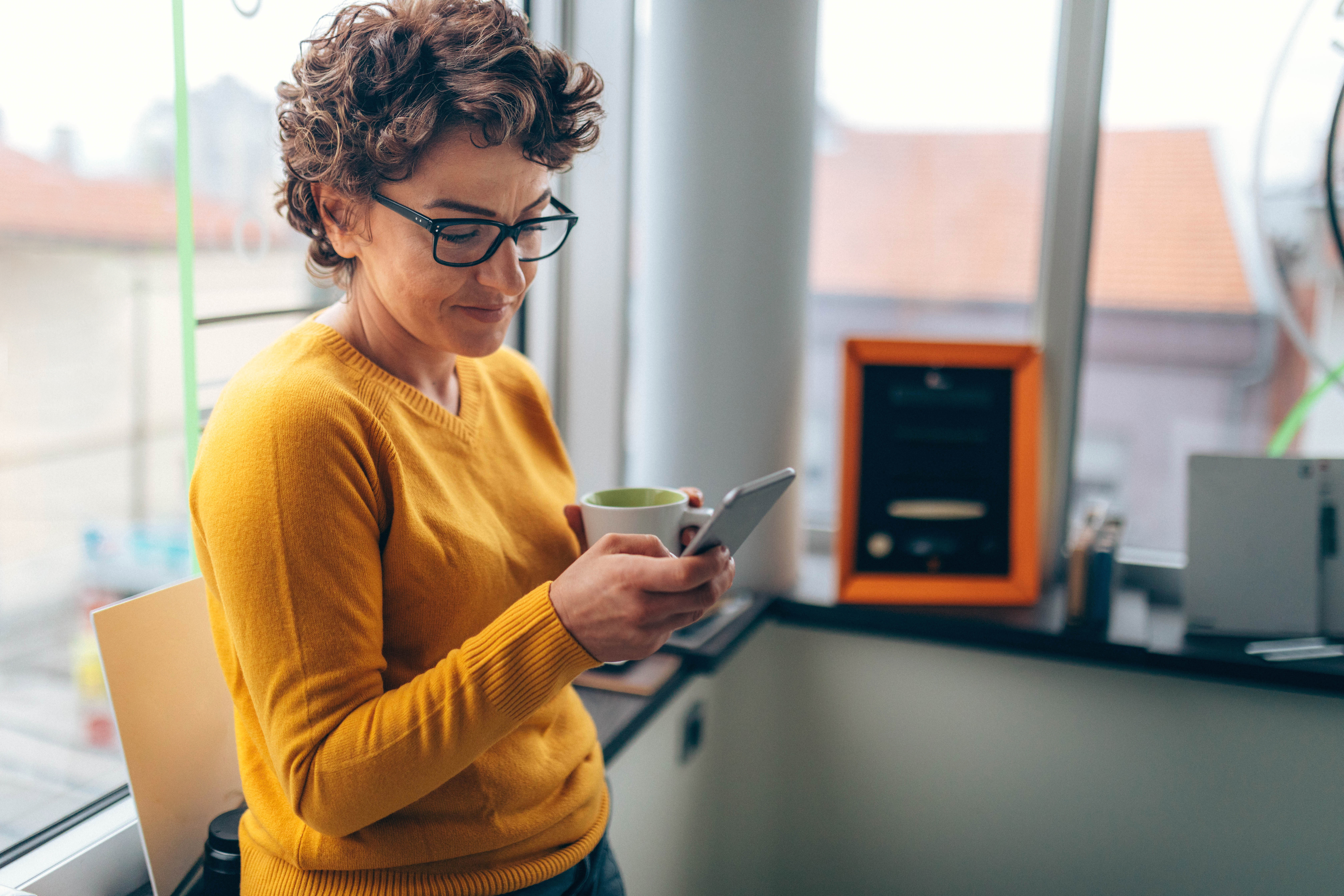 Woman on mobile phone in office